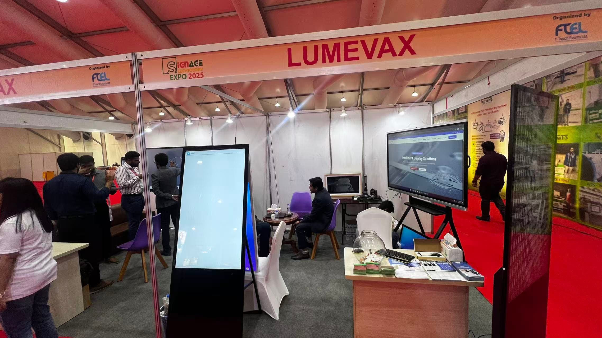 Retail business owners discussing digital signage solutions